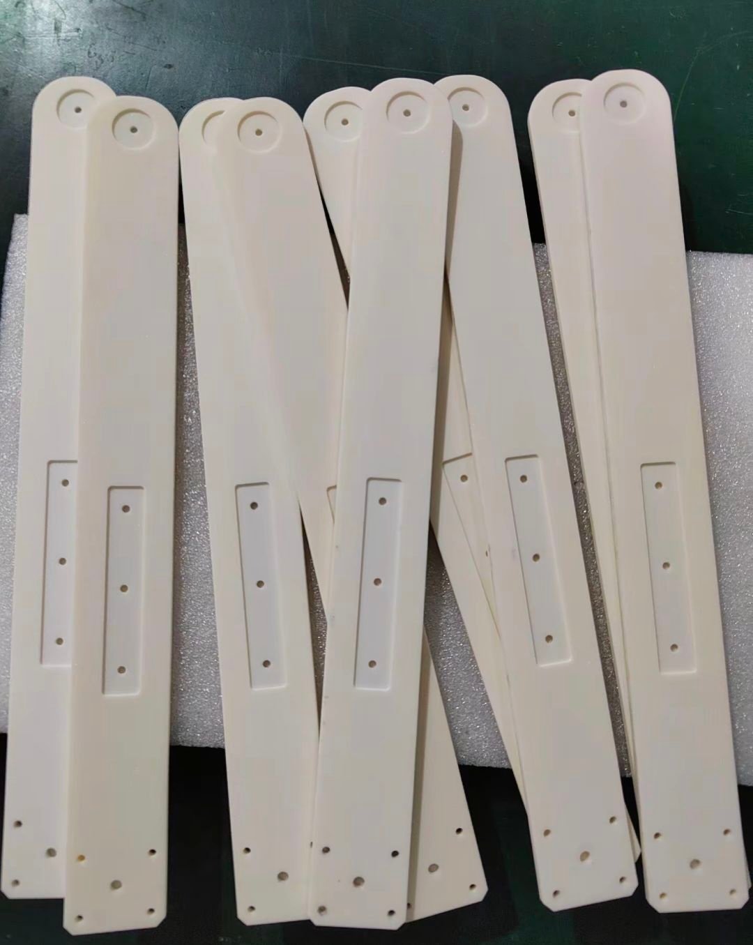 Machined alumina ceramic components with precision holes